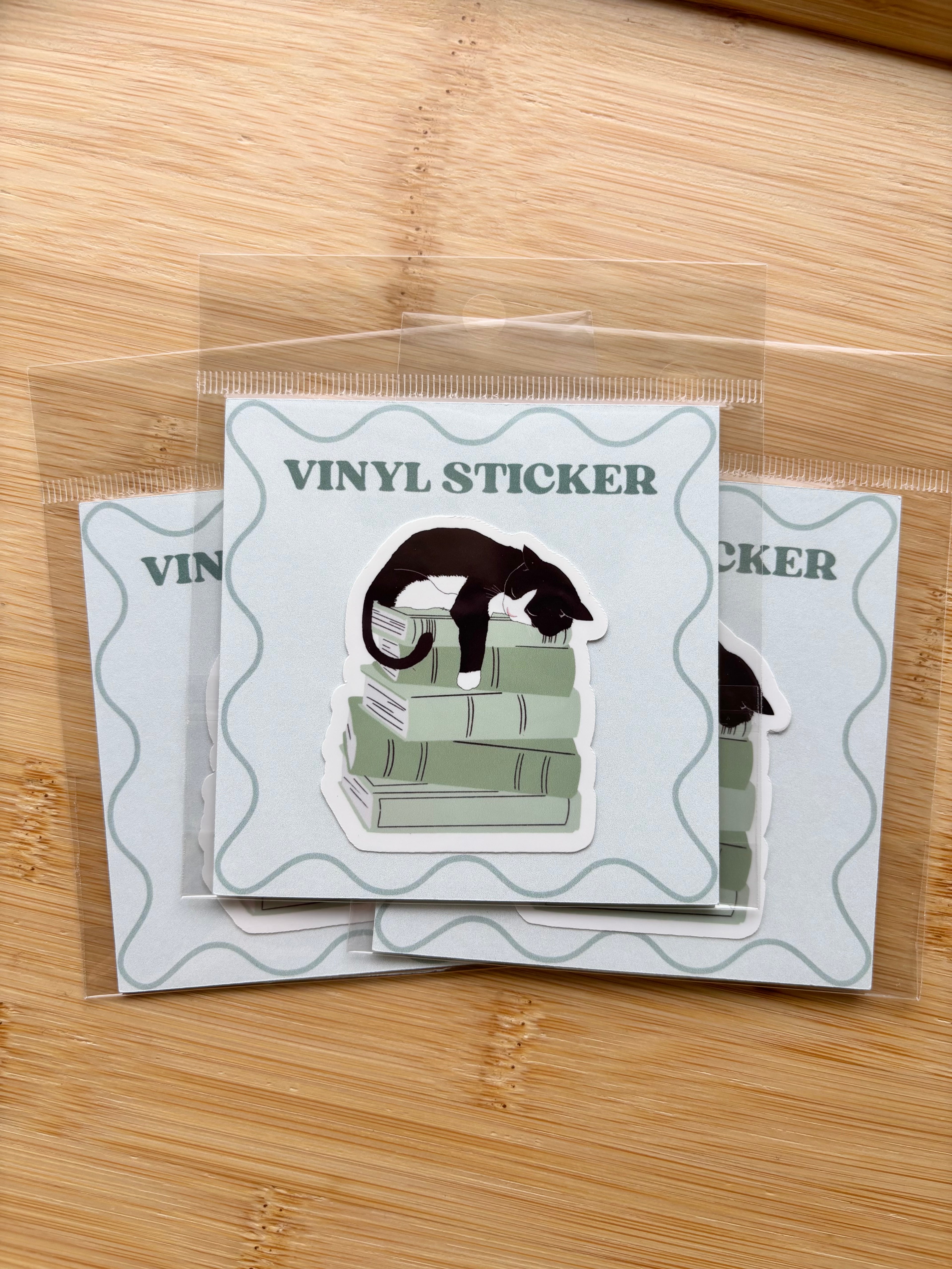 Cat on Books Sticker