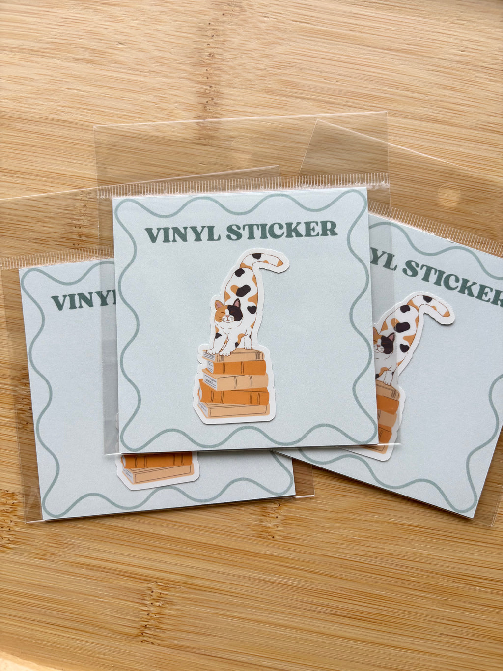 Cat on Books Sticker