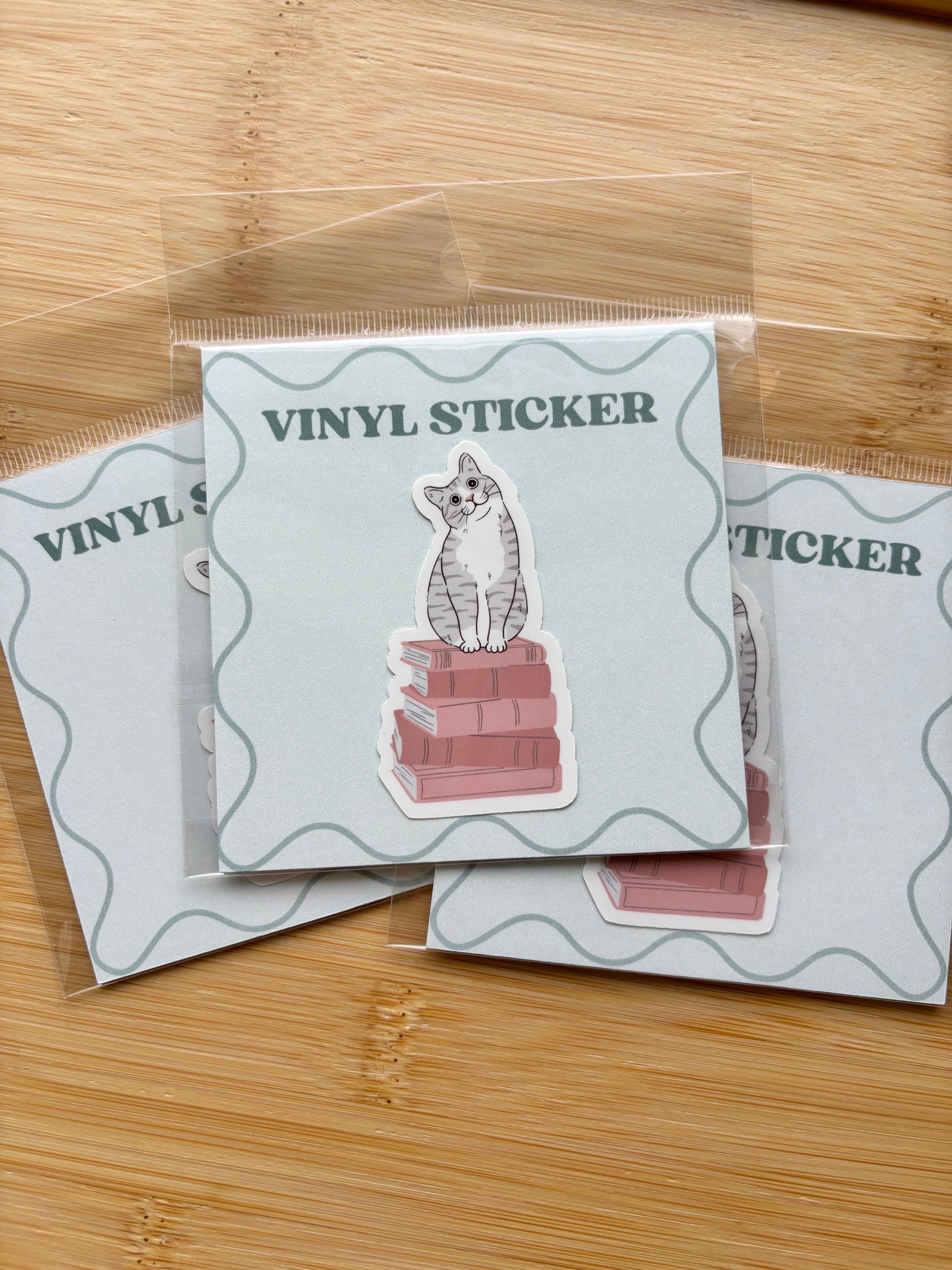 Cat on Books Sticker