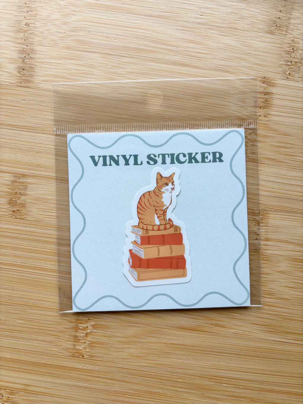 Cat on Books Sticker