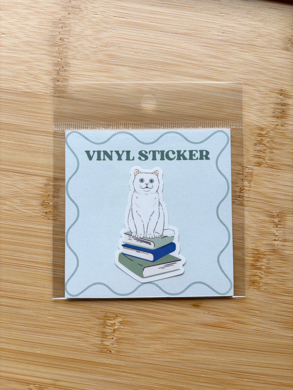 Cat on Books Sticker