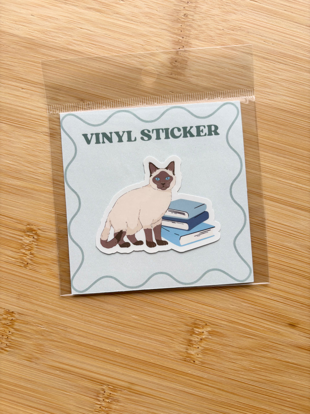Cat on Books Sticker